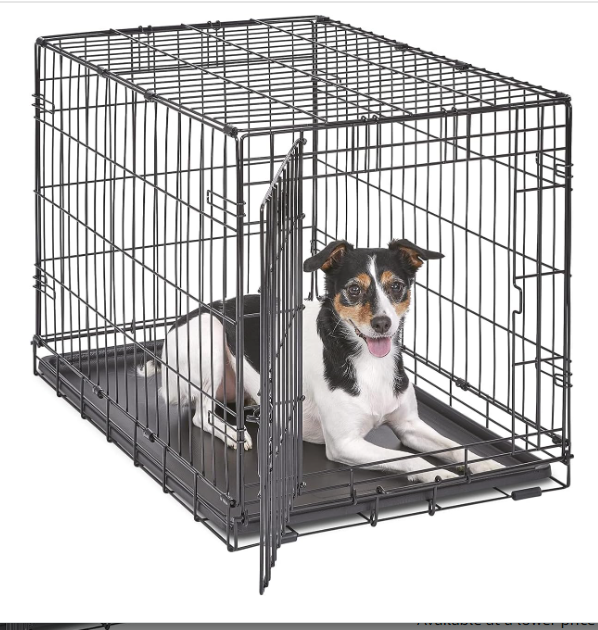 A metal dog crate with a divider panel for Miniature Schnauzers
